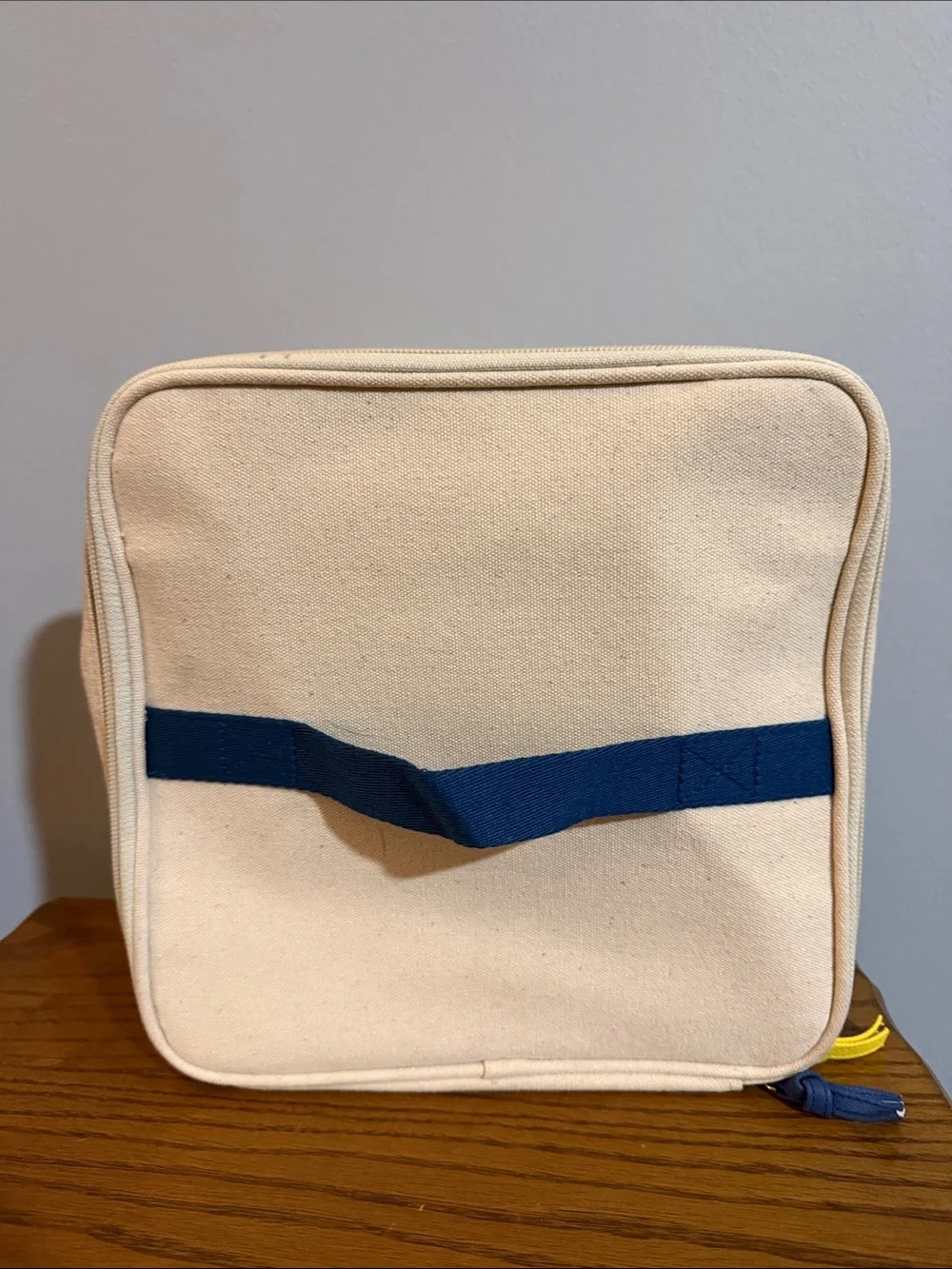 Chloe + Isabel Cream Canvas Cosmetic Pouch with Yellow & Navy Bird Logo